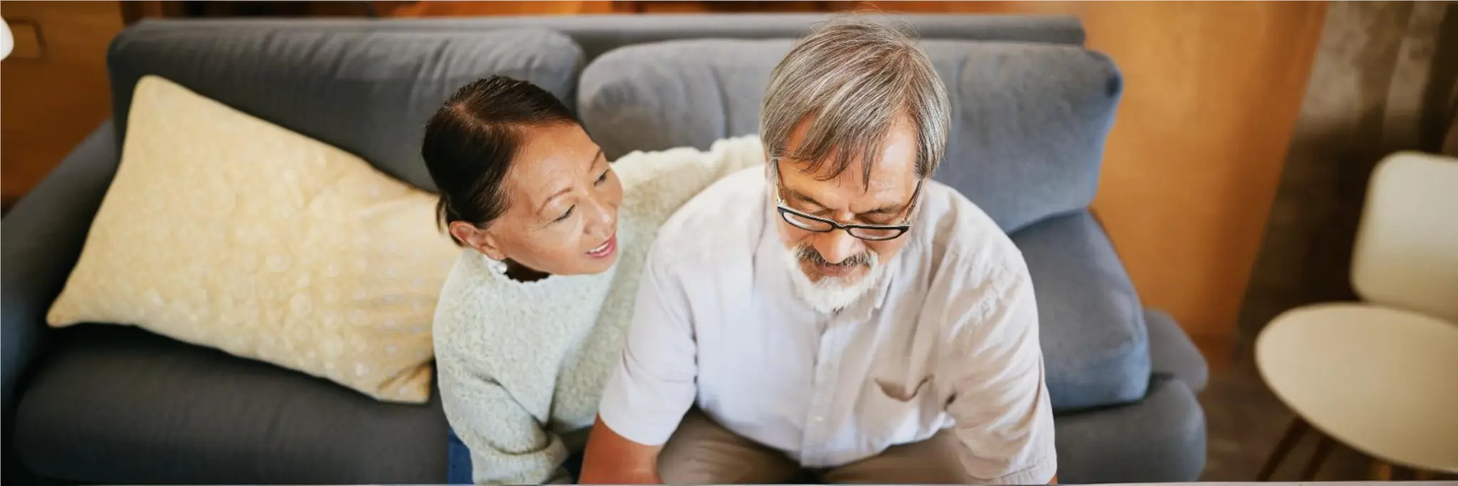 Person lying on an elevated pillow to relieve orthopnea symptoms caused by shortness of breath when lying flat.