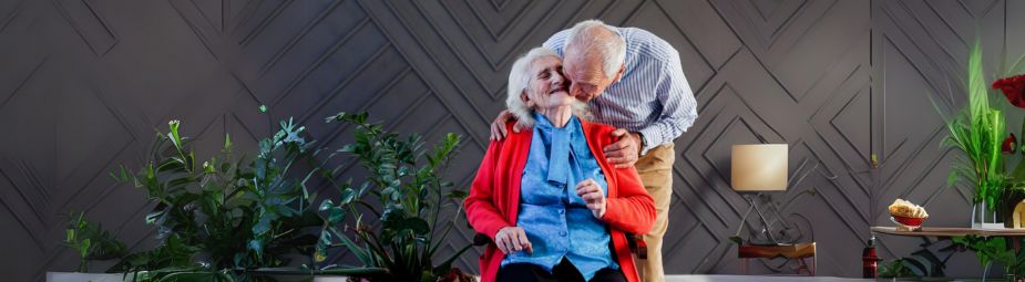Doctor explaining prostate cancer symptoms and treatment options to a patient in a medical setting.