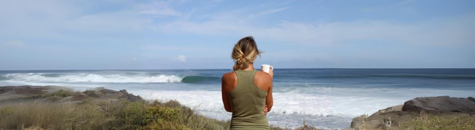 A woman sitting pensively, symbolizing the emotional impact of female sexual interest disorder and the importance of seeking treatment.