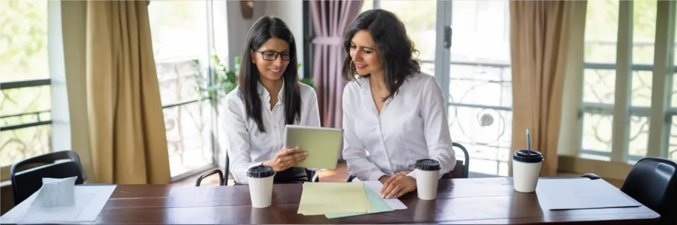 Pregnant woman monitoring blood pressure at home, emphasizing the importance of managing gestational hypertension.
