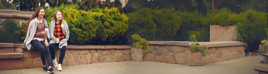 A woman holding her abdomen, symbolizing the challenges of PCOS symptoms and the importance of treatment.