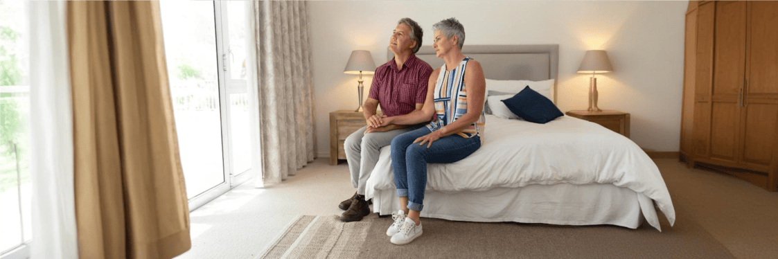 Close-up of a healthcare professional performing an ankle-brachial index test using a blood pressure cuff and Doppler device.