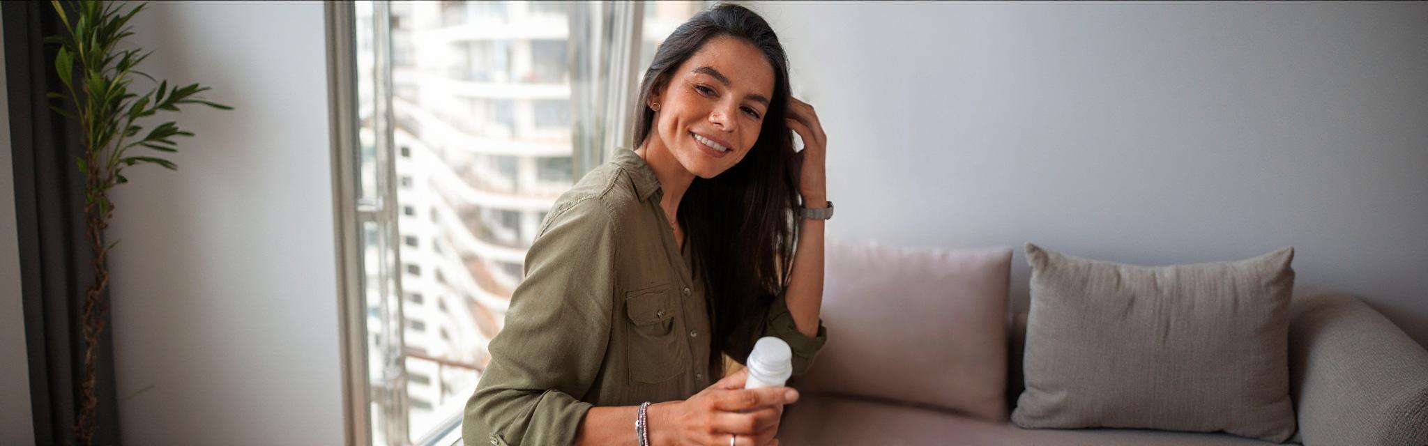 Close-up of a healthcare professional holding a syringe, representing biologic therapy for chronic conditions.