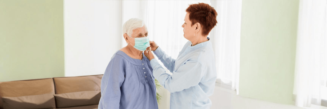 Healthcare professional checking a patient's wrist pulse during a peripheral pulse examination to assess circulatory health.