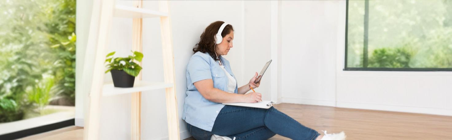 A patient undergoing virtual reality posturography for balance assessment using a VR headset and specialized platform.