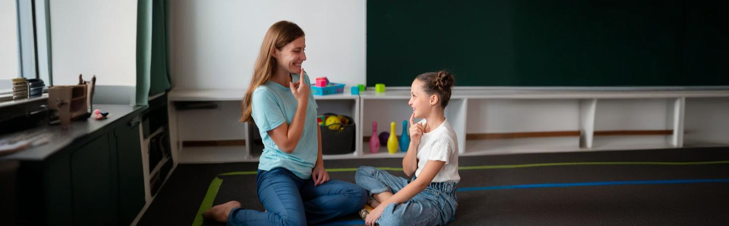 A speech-language pathologist conducting an articulation test with a child to assess speech sound production.