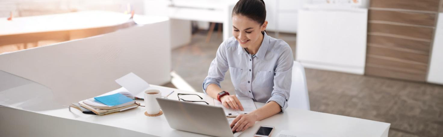 Stressed professional taking a burnout assessment test on a laptop to evaluate symptoms and manage workplace stress.