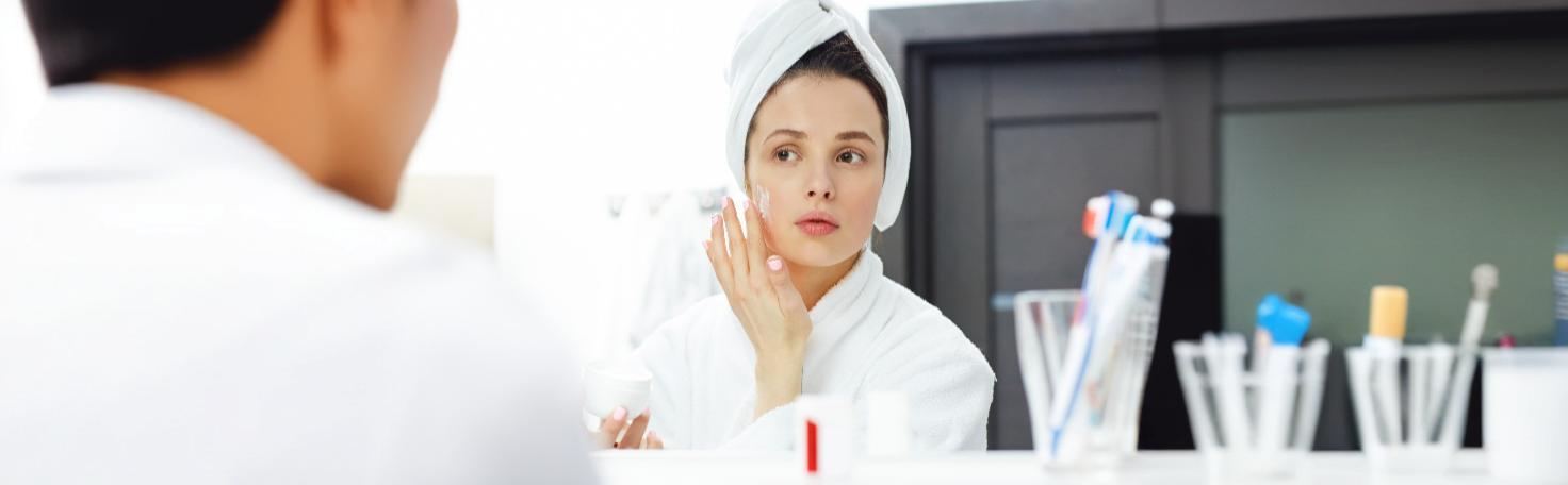 Woman receiving a professional chemical peel treatment for melasma and skin pigmentation correction.