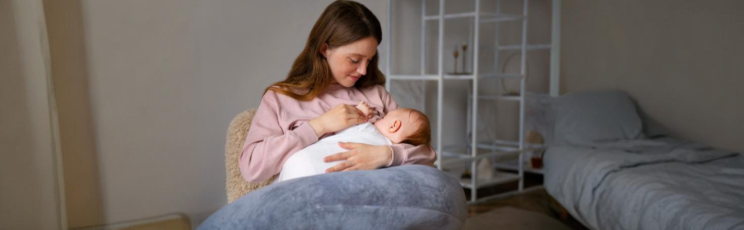 Newborn undergoing the Guthrie test, a heel prick blood test for PKU and metabolic disorder screening.