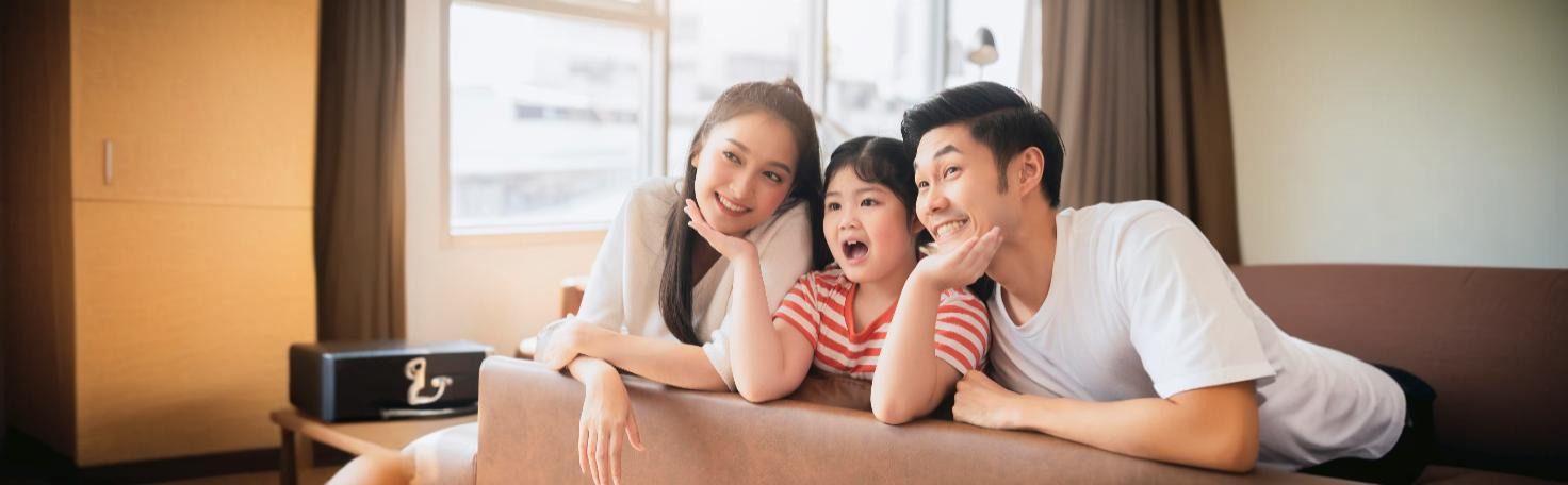 A family discussing emotional health with a therapist, using expressed emotion assessments to improve communication and support.