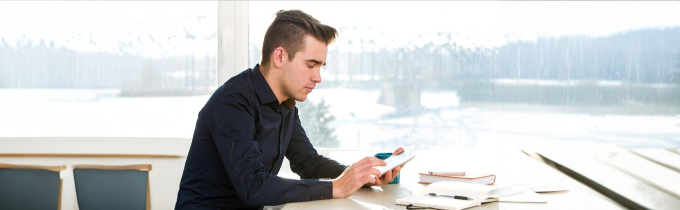 A man completing the International Index of Erectile Function (IIEF) questionnaire for erectile dysfunction assessment.