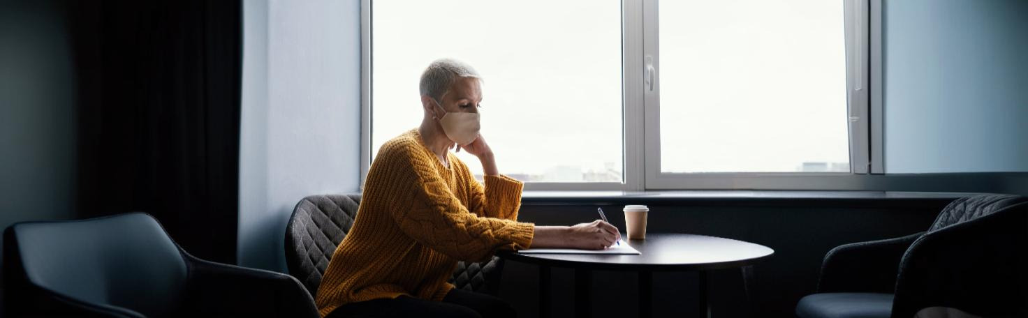 A caregiver and doctor discussing the Neuropsychiatric Inventory (NPI) test for dementia symptom evaluation.