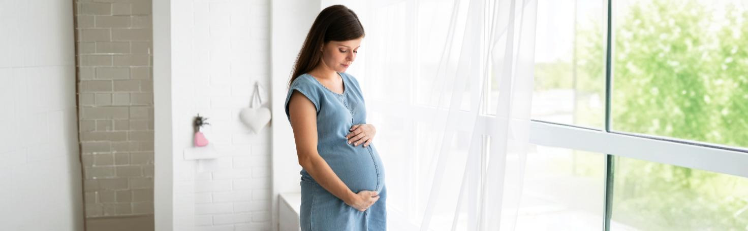 Doctor performing a placental biopsy using ultrasound guidance for prenatal genetic testing.
