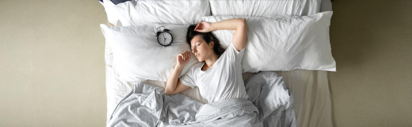 Patient undergoing a sleep-deprived EEG with electrodes monitoring brain activity for epilepsy and sleep disorder diagnosis.