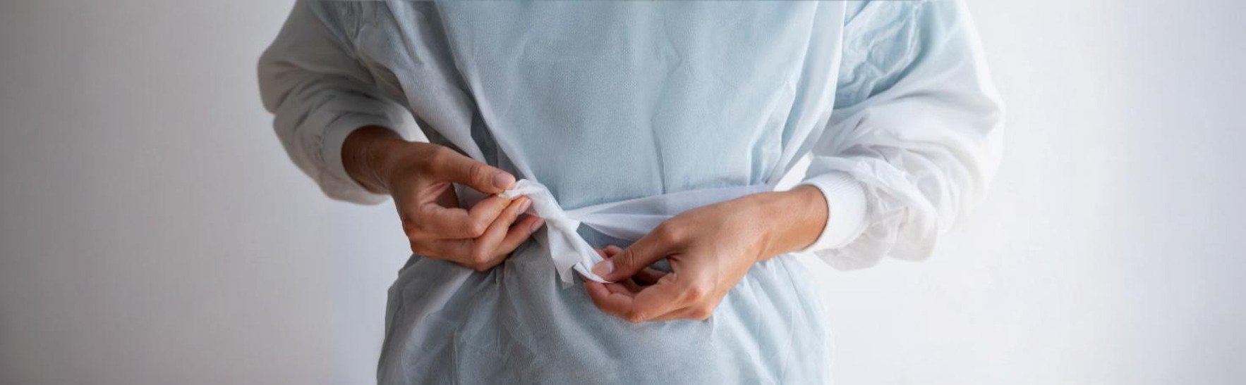 Surgeon performing staging laparoscopy to assess abdominal cancer spread using a laparoscope.