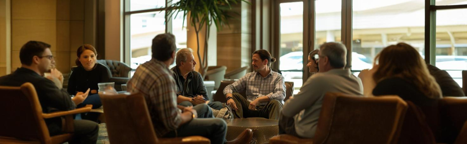 Surgeon performing aneurysm surgical ligation using precision tools to clip and secure the aneurysm.